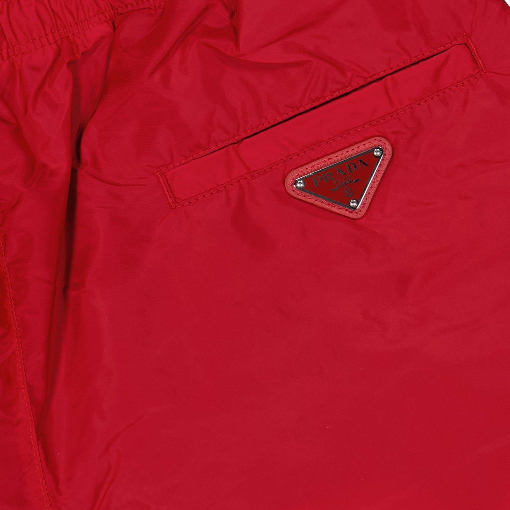 Prada swim trunks, men's luxury swimwear, red swim trunks, high-end beachwear, luxury swim trunks