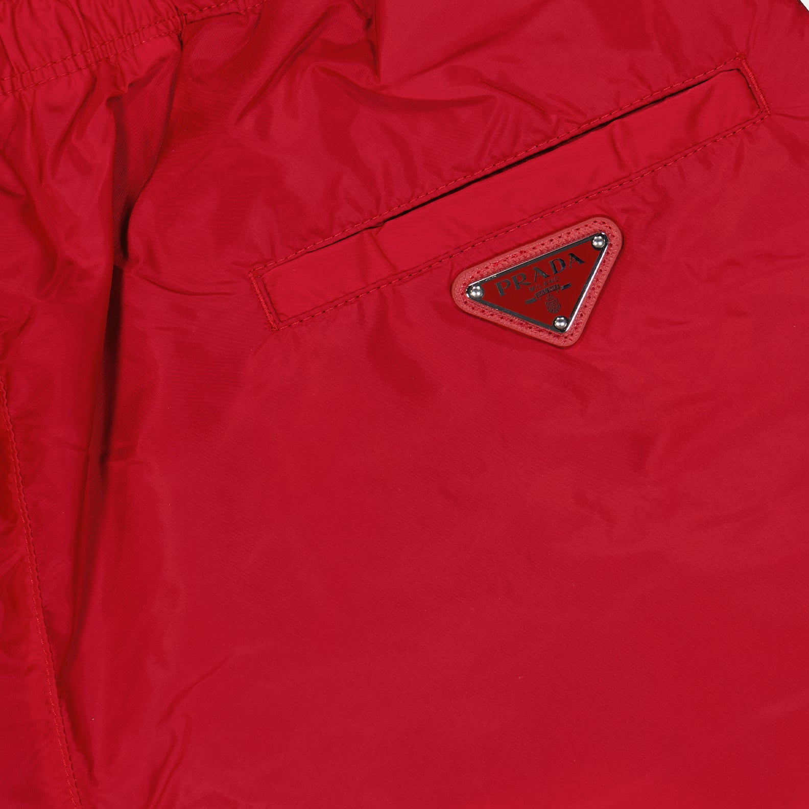 Prada swim trunks, men's luxury swimwear, red swim trunks, high-end beachwear, luxury swim trunks