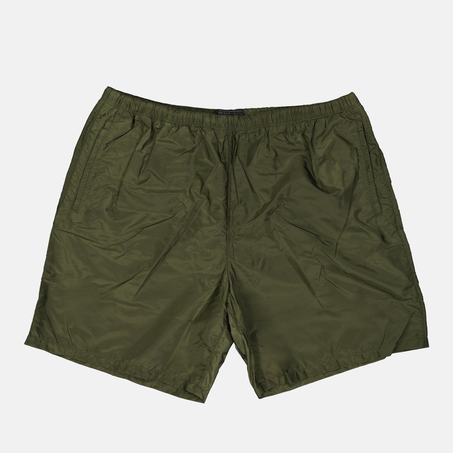 Prada swim shorts, luxury swimwear, men's beachwear, green swim shorts, designer swim shorts