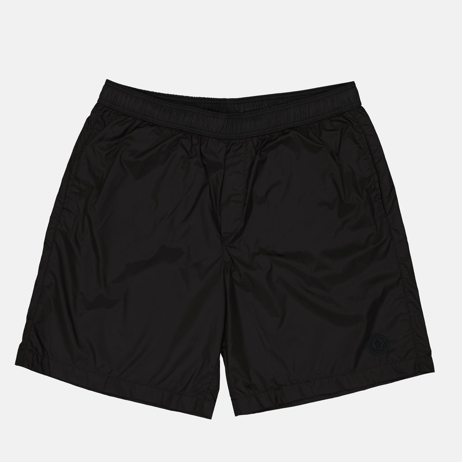 Moncler swim shorts, luxury swimwear, men's designer swimwear, black logo swim shorts, high-end beachwear