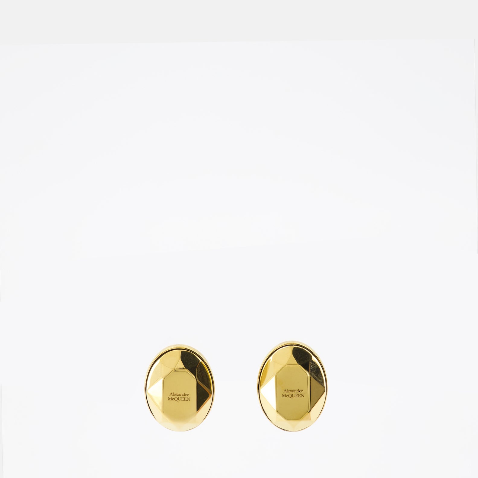 Alexander McQueen earrings, luxury jewelry, gold earrings, faceted stone, high fashion accessories