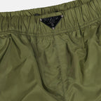 Prada swim shorts, green swim shorts, luxury beachwear, designer swimwear, men's fashion
