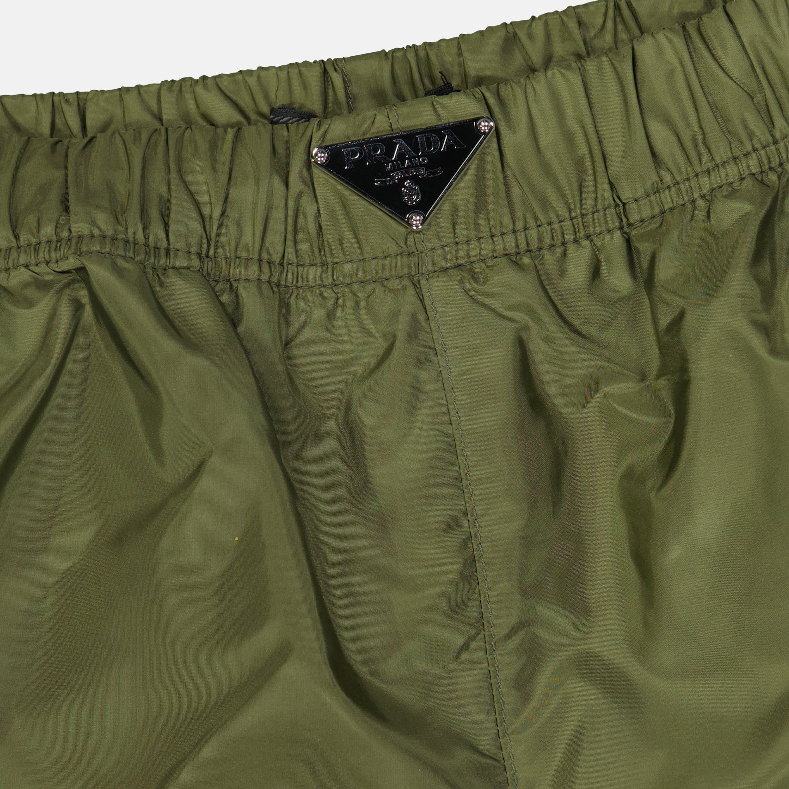 Prada swim shorts, green swim shorts, luxury beachwear, designer swimwear, men's fashion
