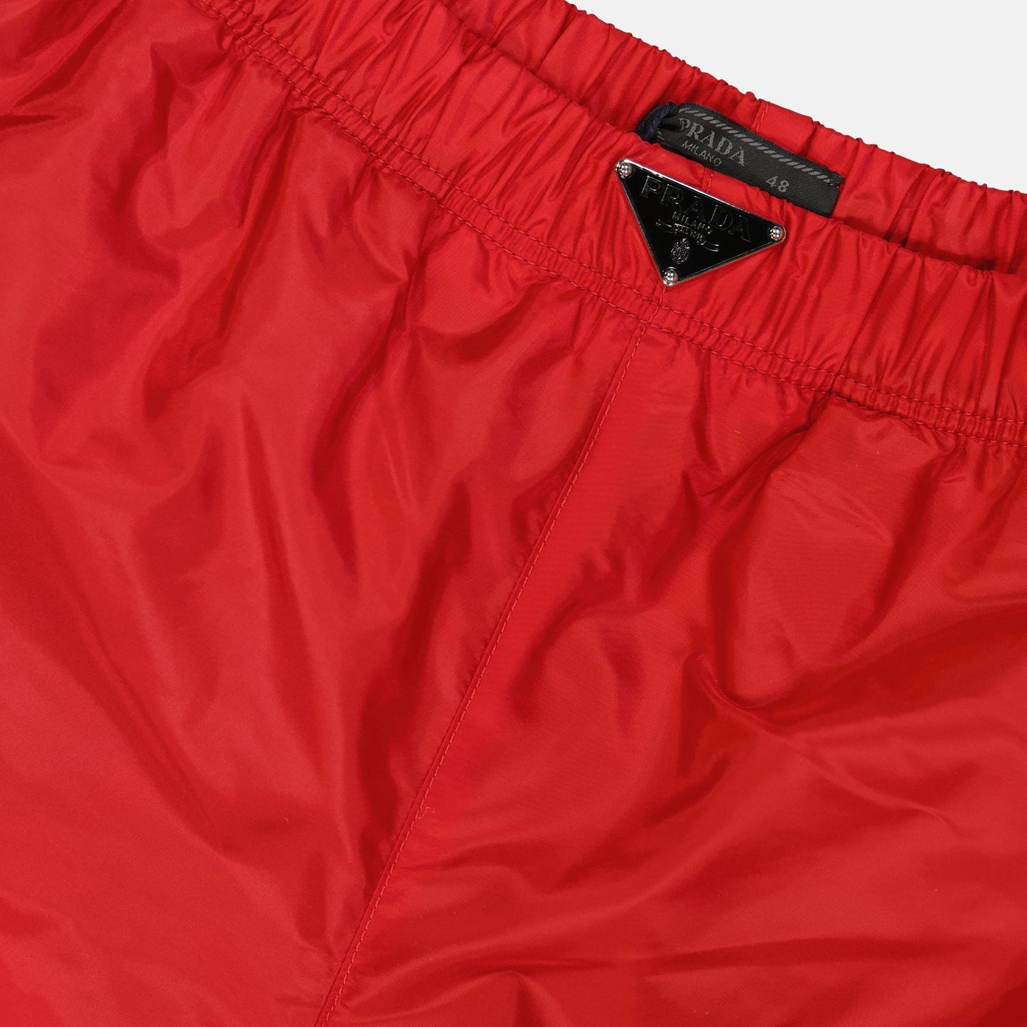 Prada swim shorts, red swimwear, luxury swimwear, designer beachwear, logo swim shorts