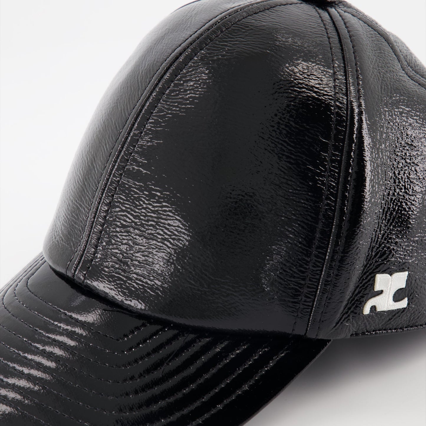 Vinyl cap, Courrèges cap, black reissue cap, luxury headwear, designer accessories