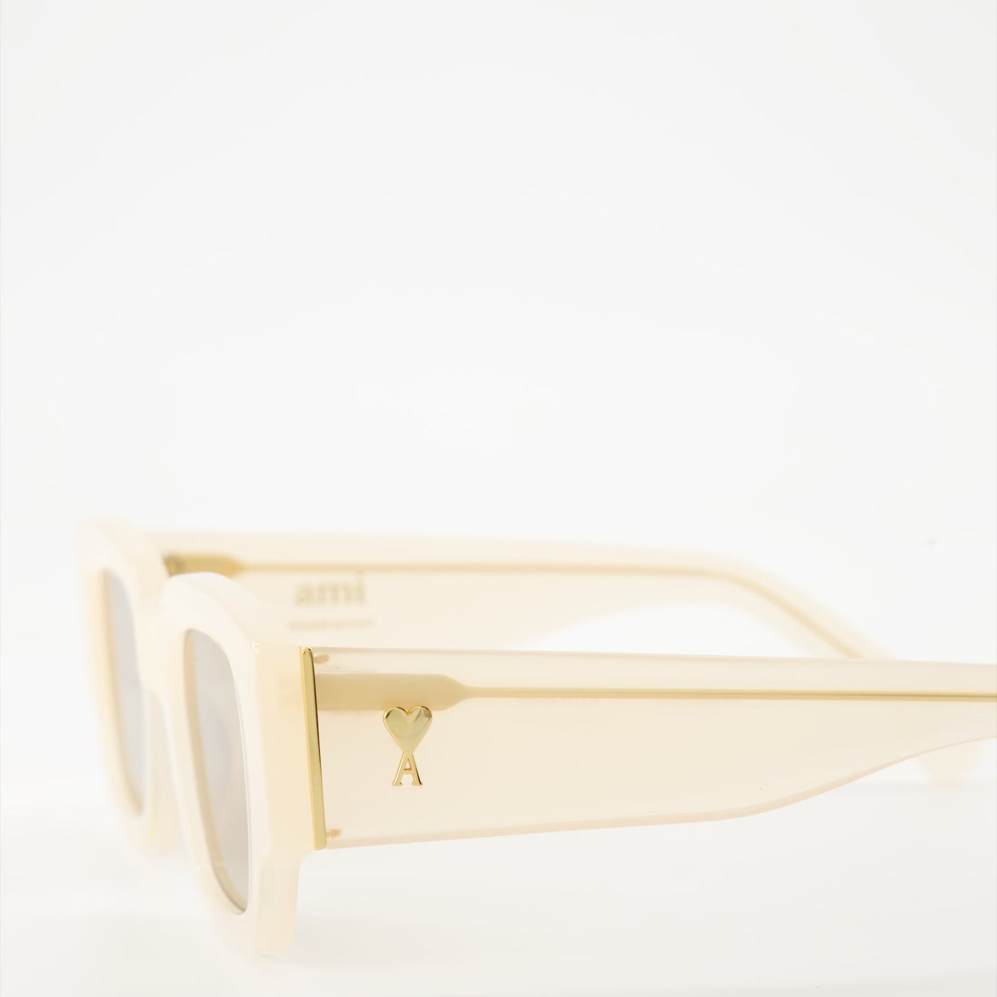 luxury sunglasses, beige sunglasses, AMI Paris, designer eyewear, unisex sunglasses