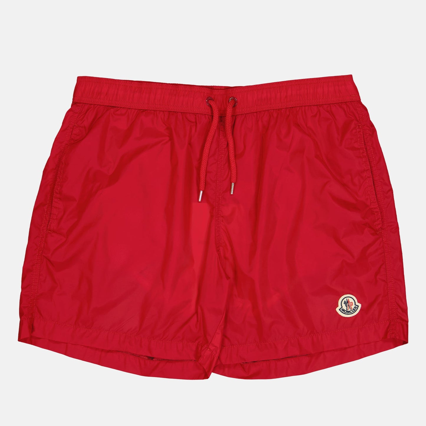 red logo swim shorts, Moncler swimwear, luxury swim shorts, designer swimwear, summer essentials