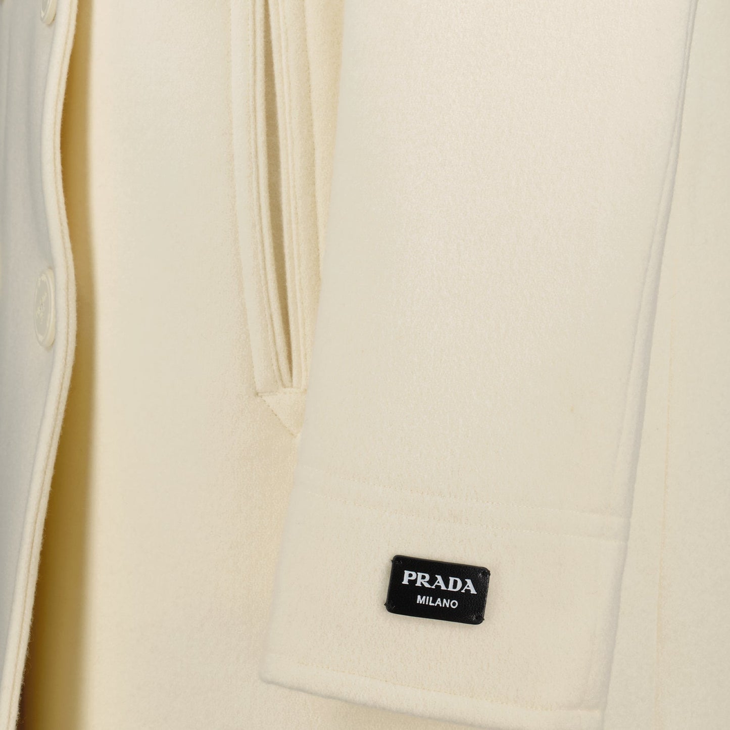 Prada pea coat, wool pea coat, luxury outerwear, double-breasted coat, elegant white coat