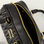 Image of Le Sac Arcadie Noir by Miu Miu for Women - Season Spring-Summer 2026 - Detail View 1