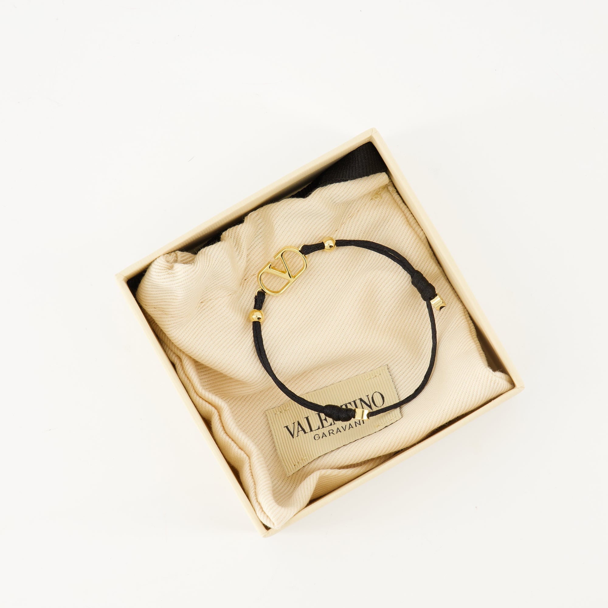 Valentino Garavani bracelet, VLogo signature accessory, cotton bracelet, gold finish jewelry, luxury fashion bracelet