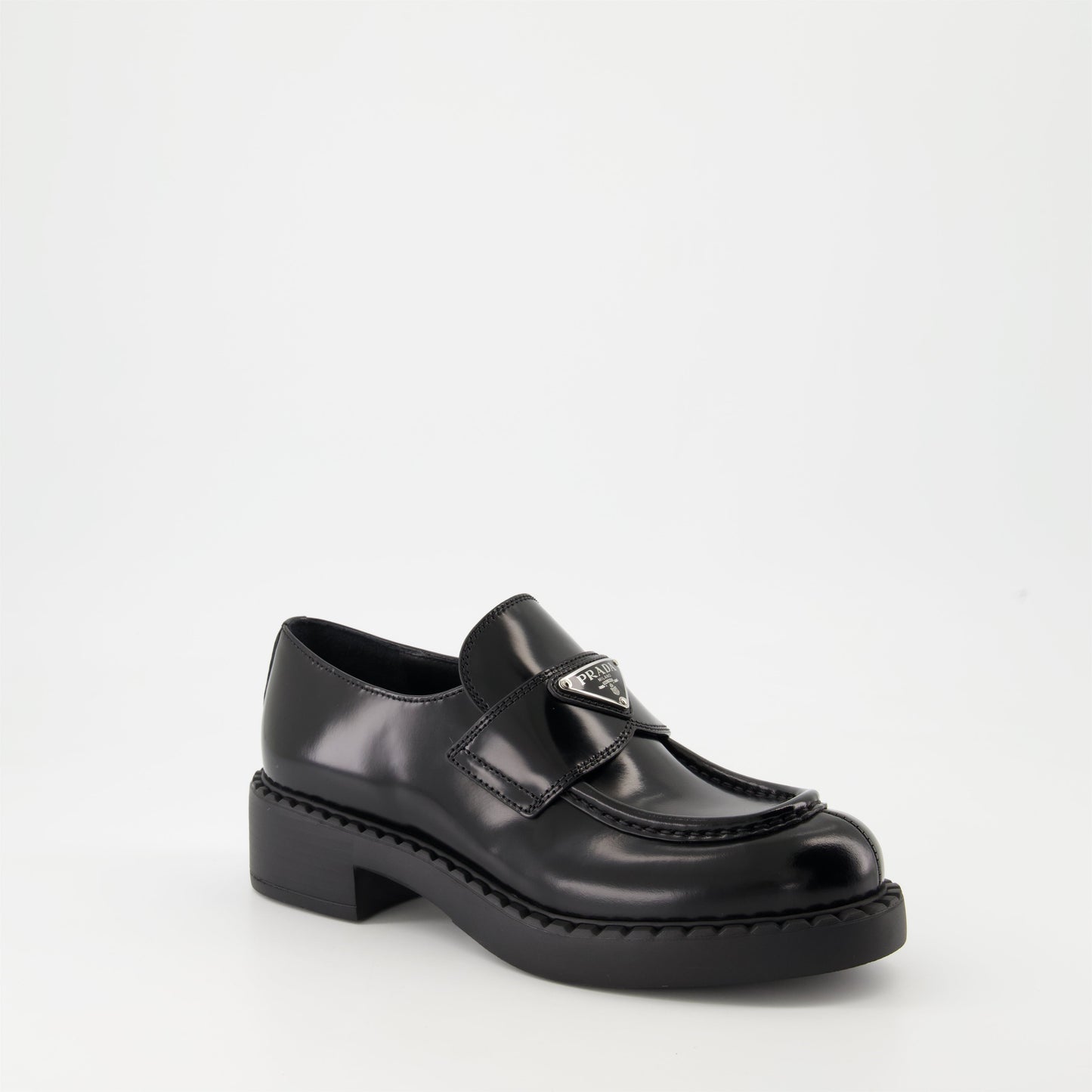 patent leather mocassins, luxury footwear, Prada AW24, black mocassins, elegant shoes