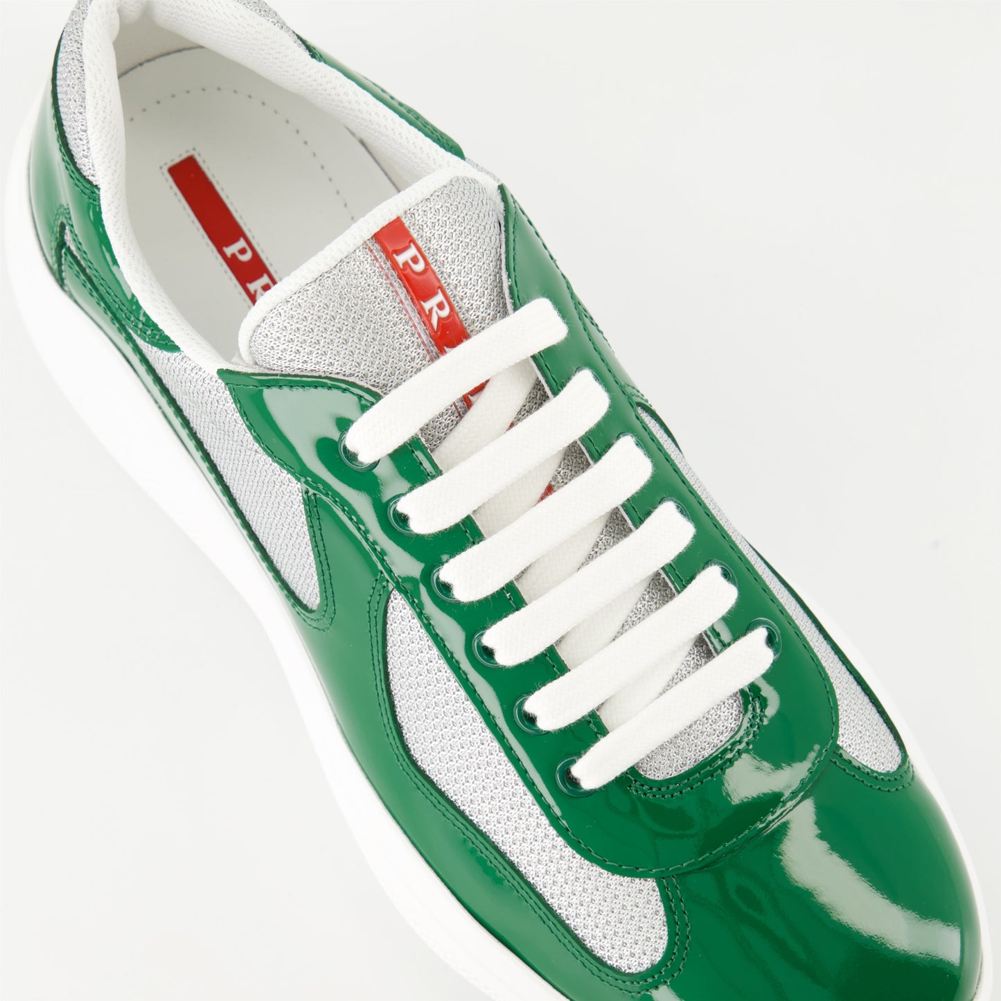 Prada sneakers, patent leather shoes, bicolor design sneakers, luxury men's footwear, Autumn-Winter 2024 collection