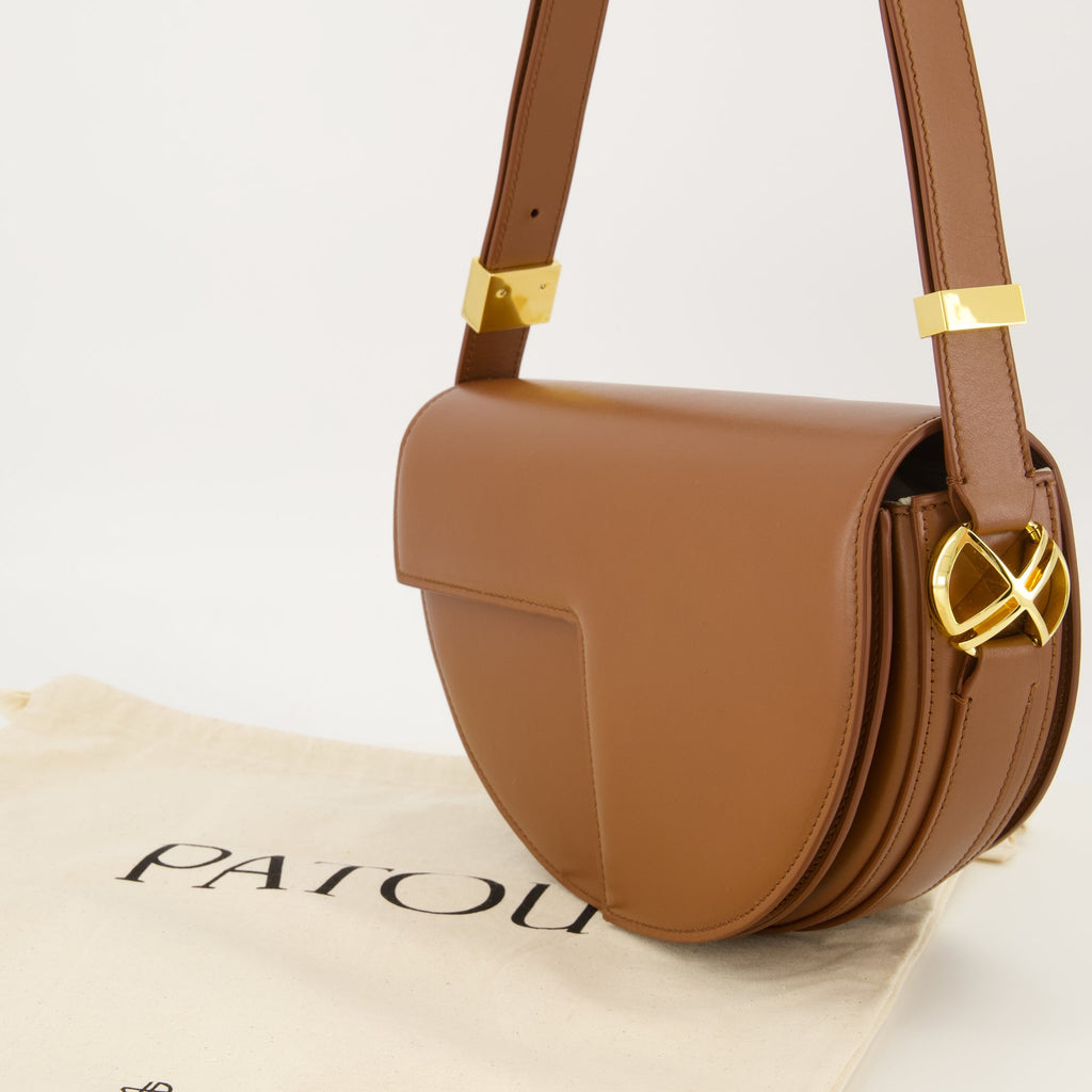 brown handbag, Patou handbag, leather shoulder bag, semi-circular bag, chic bag