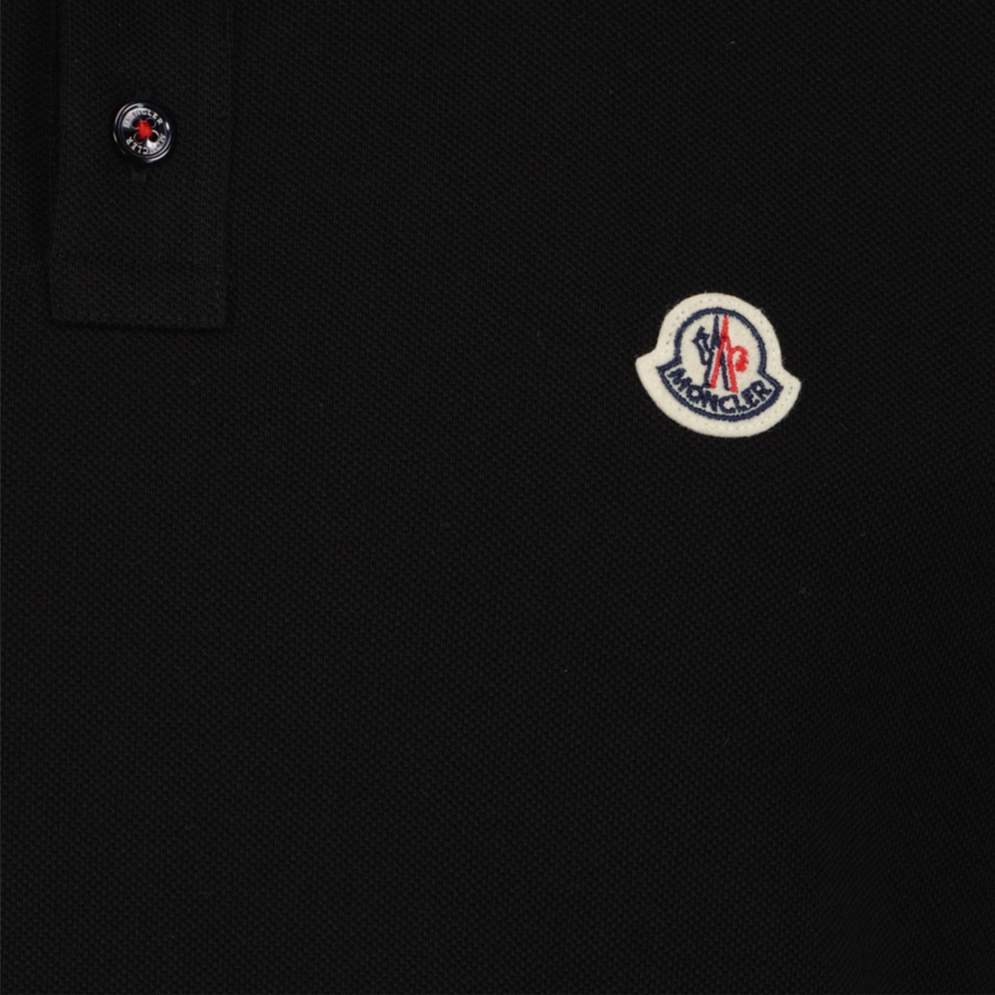 Image of Polo à logo en coton noir by Moncler for Men - Season Spring-Summer 2026 - Detail View 1
