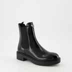 Image of Patent Leather Ankle Boots by Prada for Women - Season Autumn-Winter 2024 - Back Right Three-Quarter View