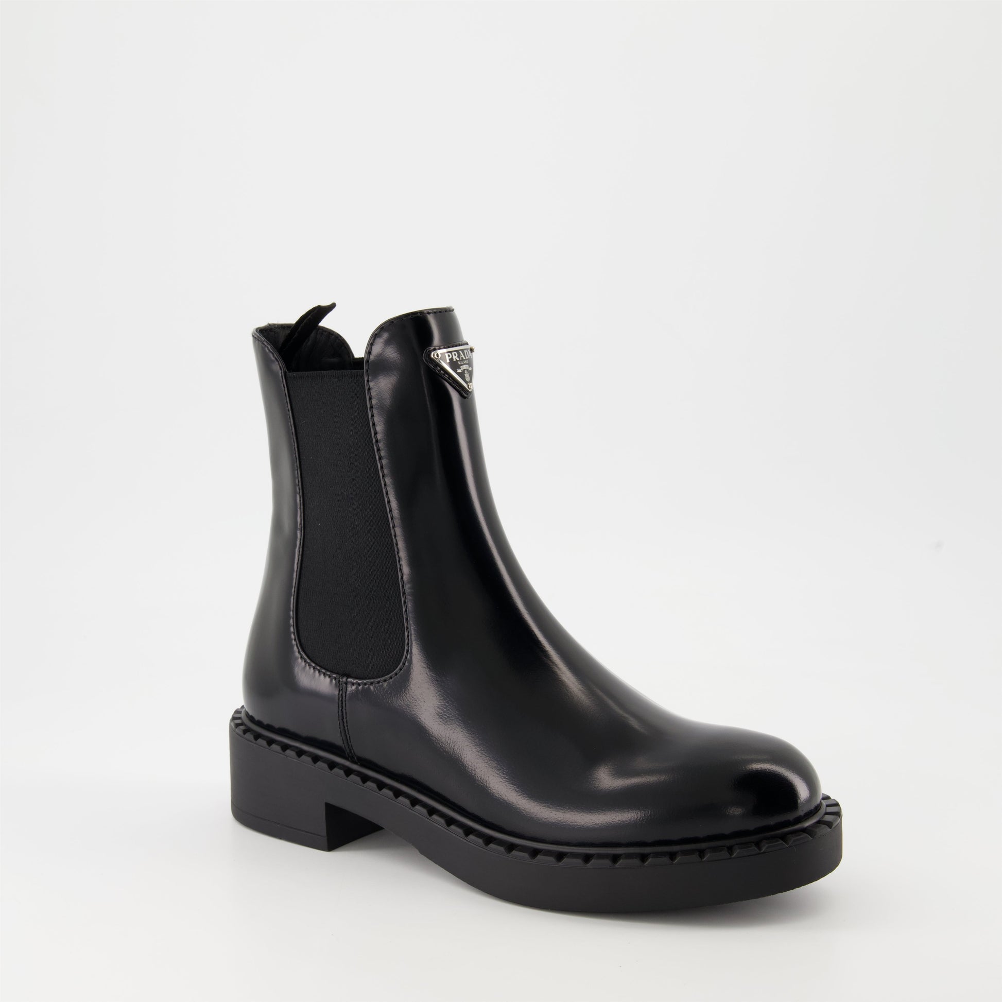   Patent leather boots, Prada ankle boots, black patent shoes, luxury footwear, autumn-winter collection.