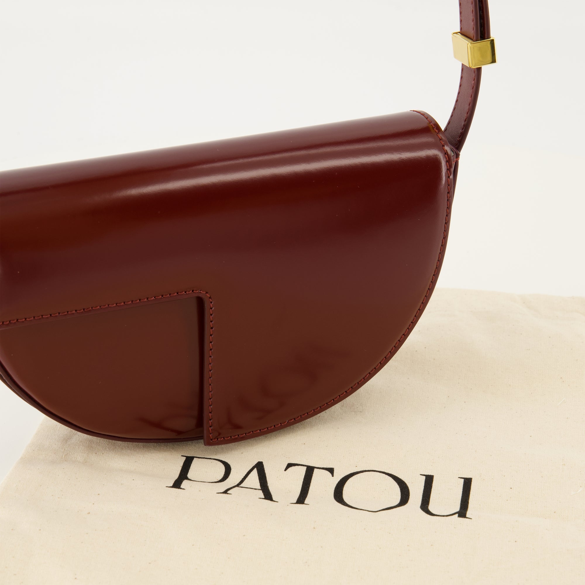 Le Petit Patou bag, bordeaux handbag, half-moon bag, high-quality leather bag, adjustable shoulder strap