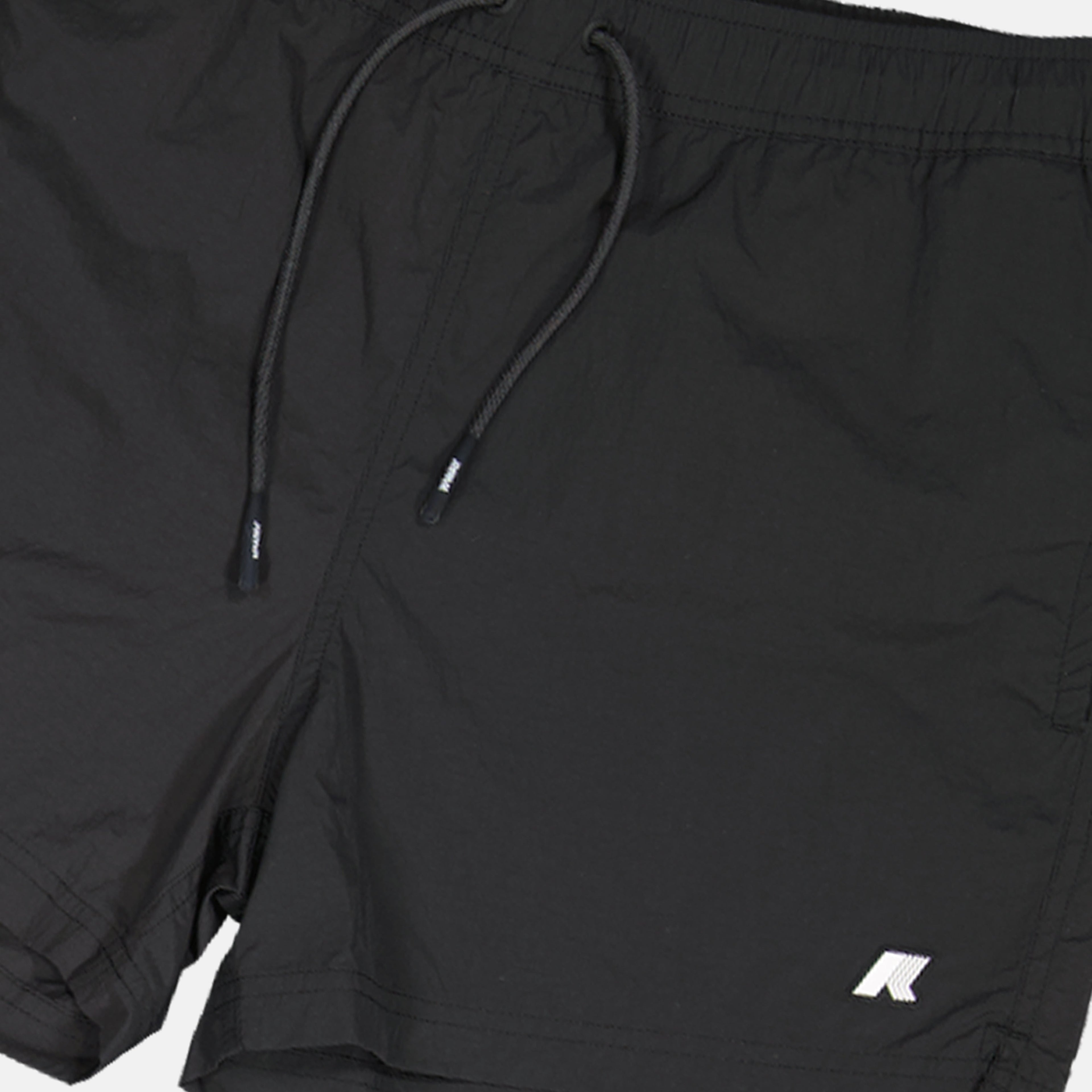 swim shorts, seersucker fabric, black swimwear, practical pockets, summer essentials