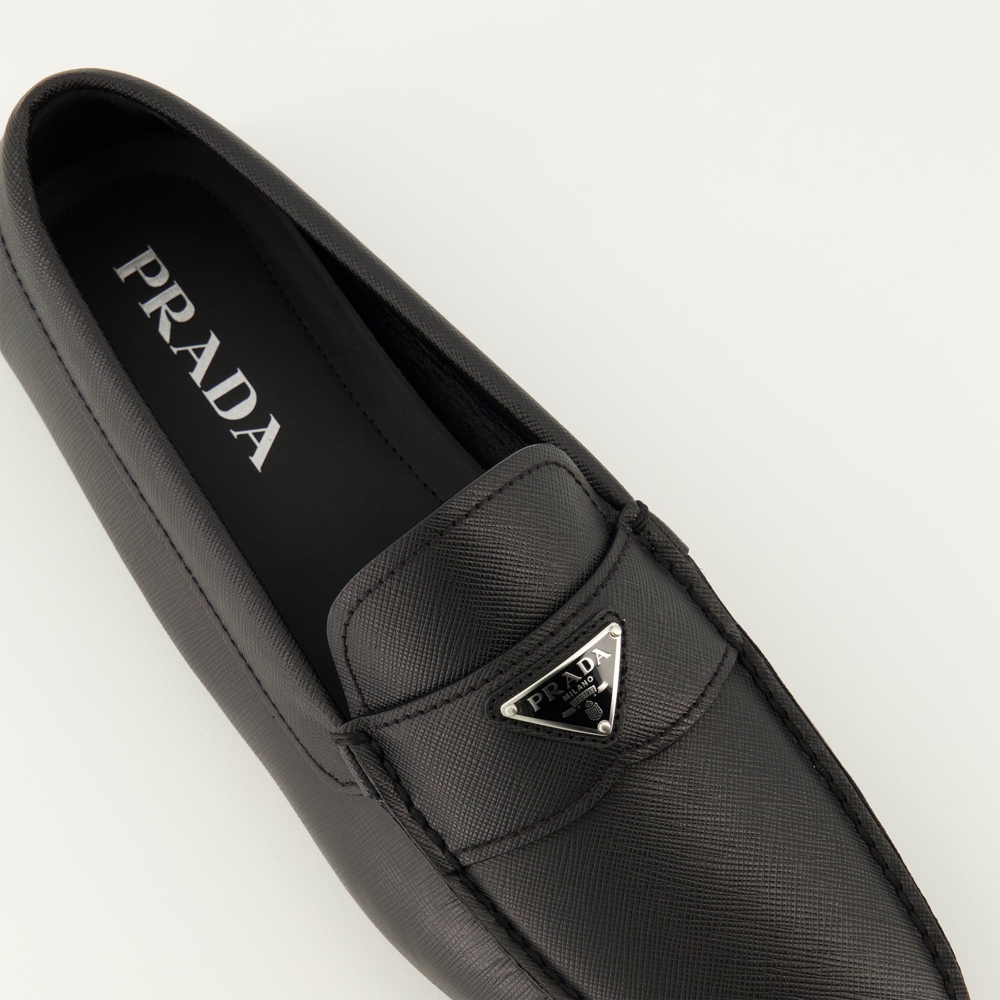 Image of Prada Black Leather Moccasins by Prada for Men - Season Spring-Summer 2026 - Top Detail View