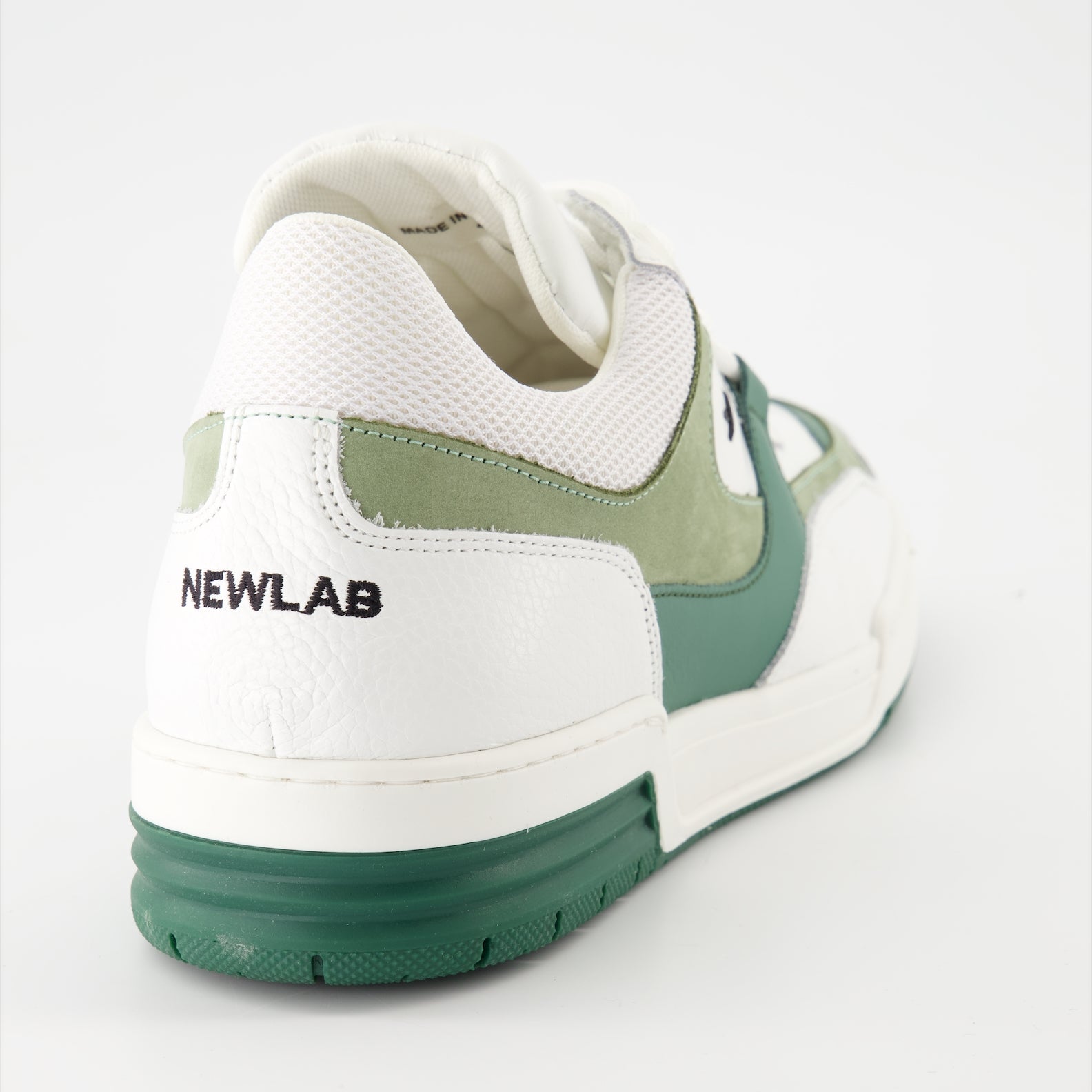 luxury sneakers, white leather shoes, green suede accents, New Lab collection, high-end fashion