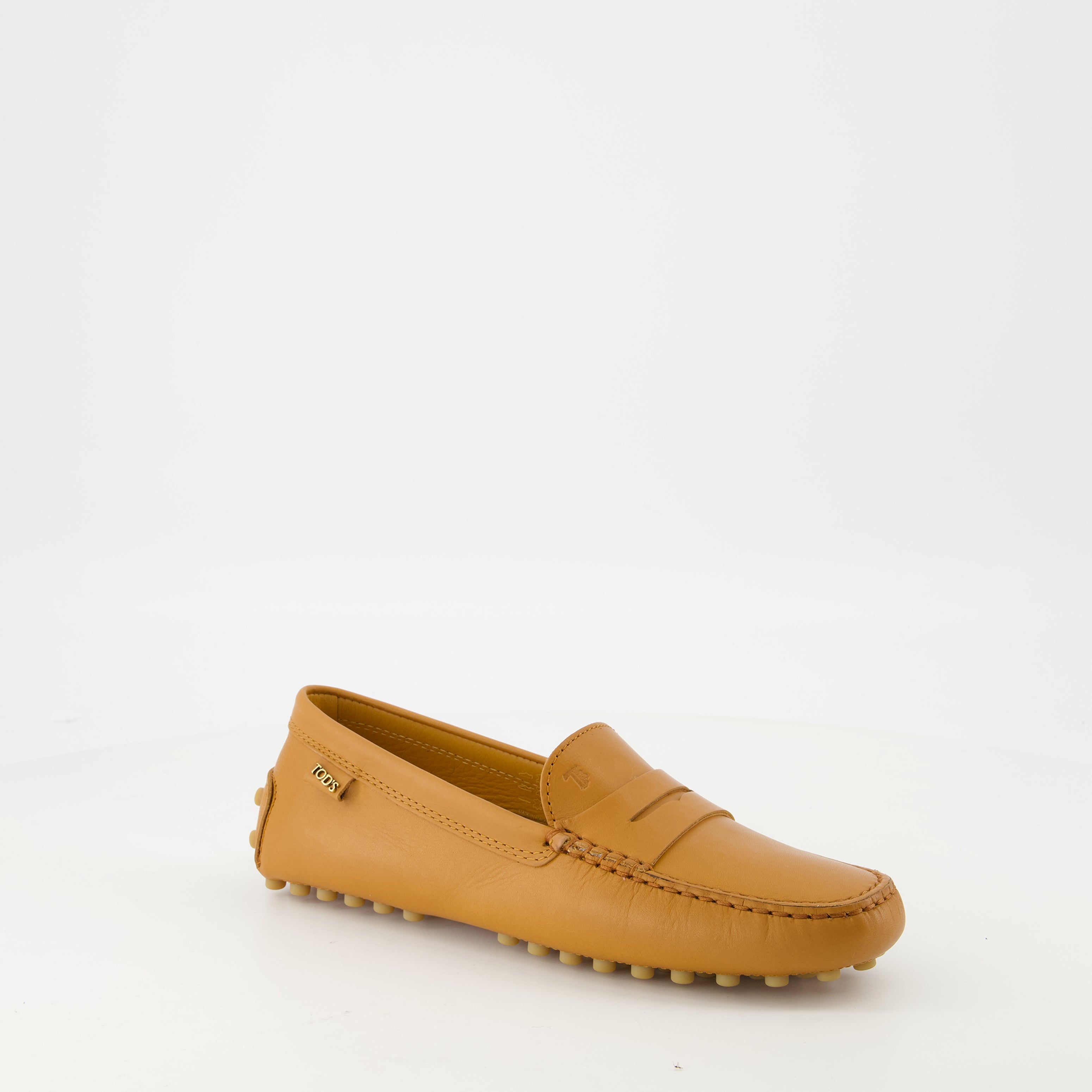 Tod's loafers, Gommino loafers, leather footwear, luxury loafers, brown leather shoes