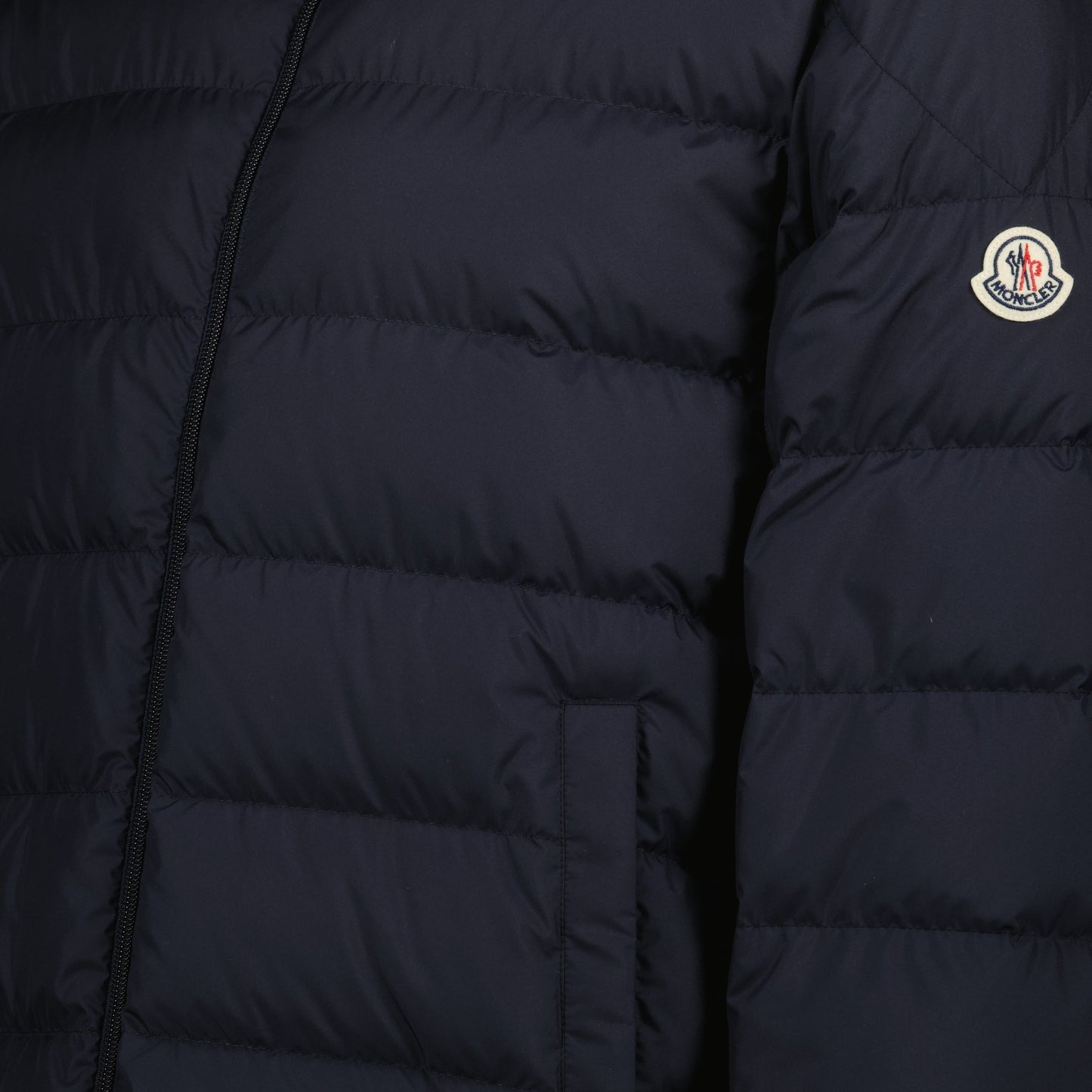 blue down jacket, winter outerwear, Moncler jacket, recycled materials, stylish outerwear