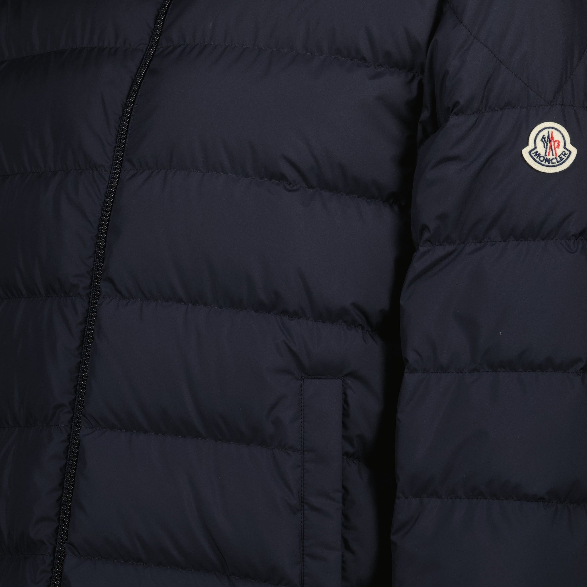 blue down jacket, winter outerwear, Moncler jacket, recycled materials, stylish outerwear