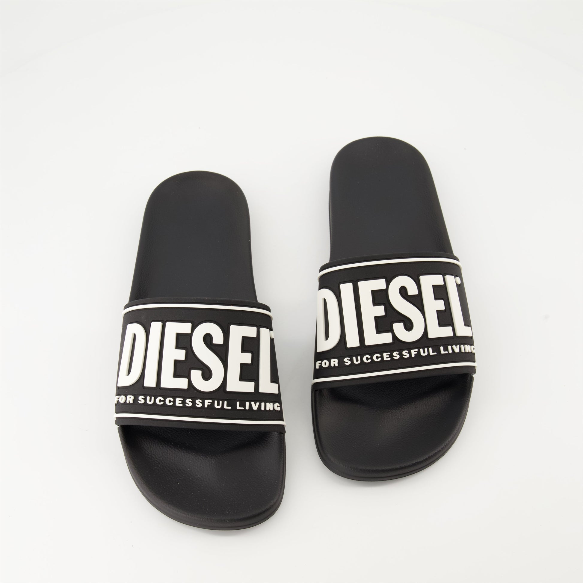 luxury slides, black slides, designer footwear, Diesel Autumn-Winter 2024, comfortable molded sole