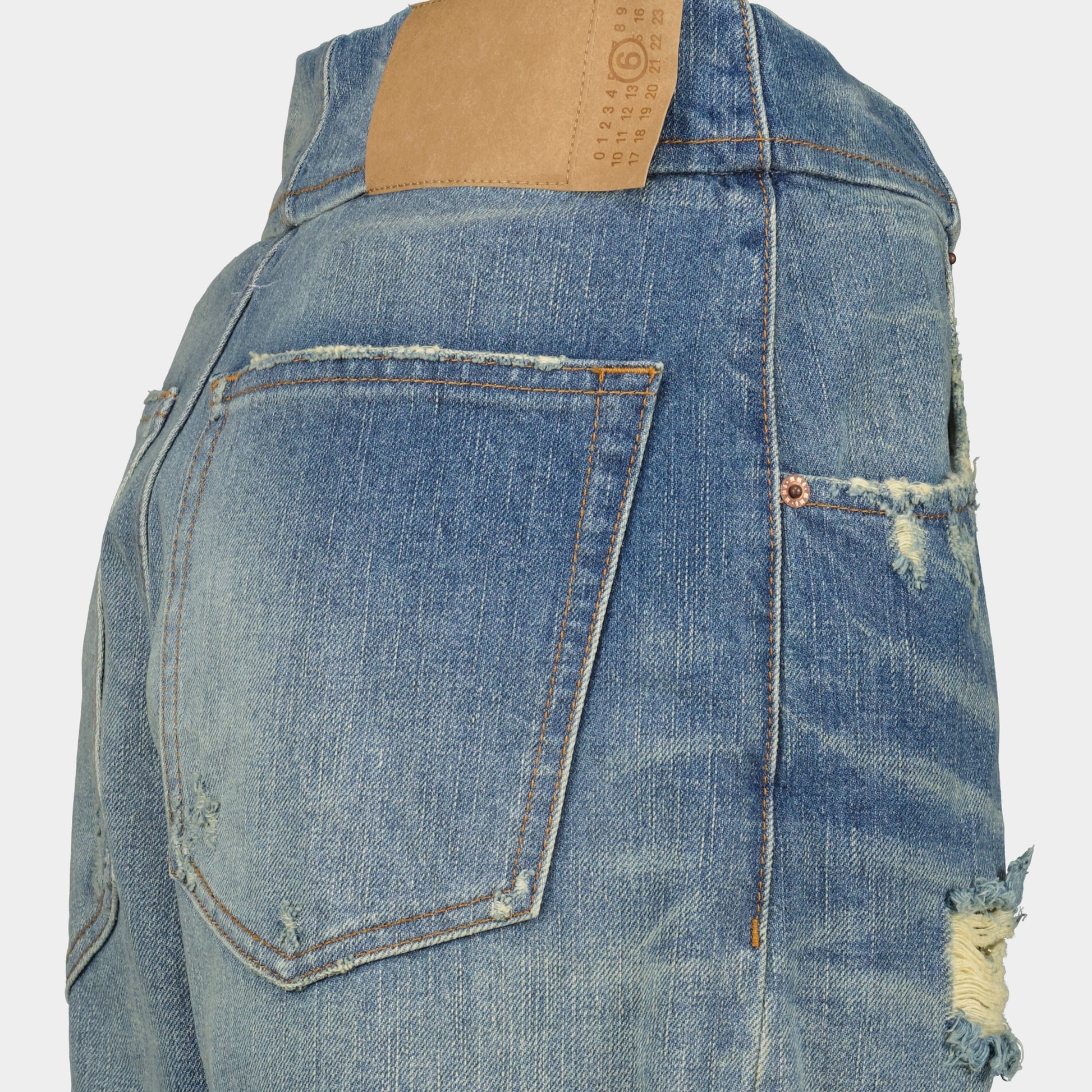 worn straight jeans, MM6 jeans, faded denim, distressed style, five-pocket design