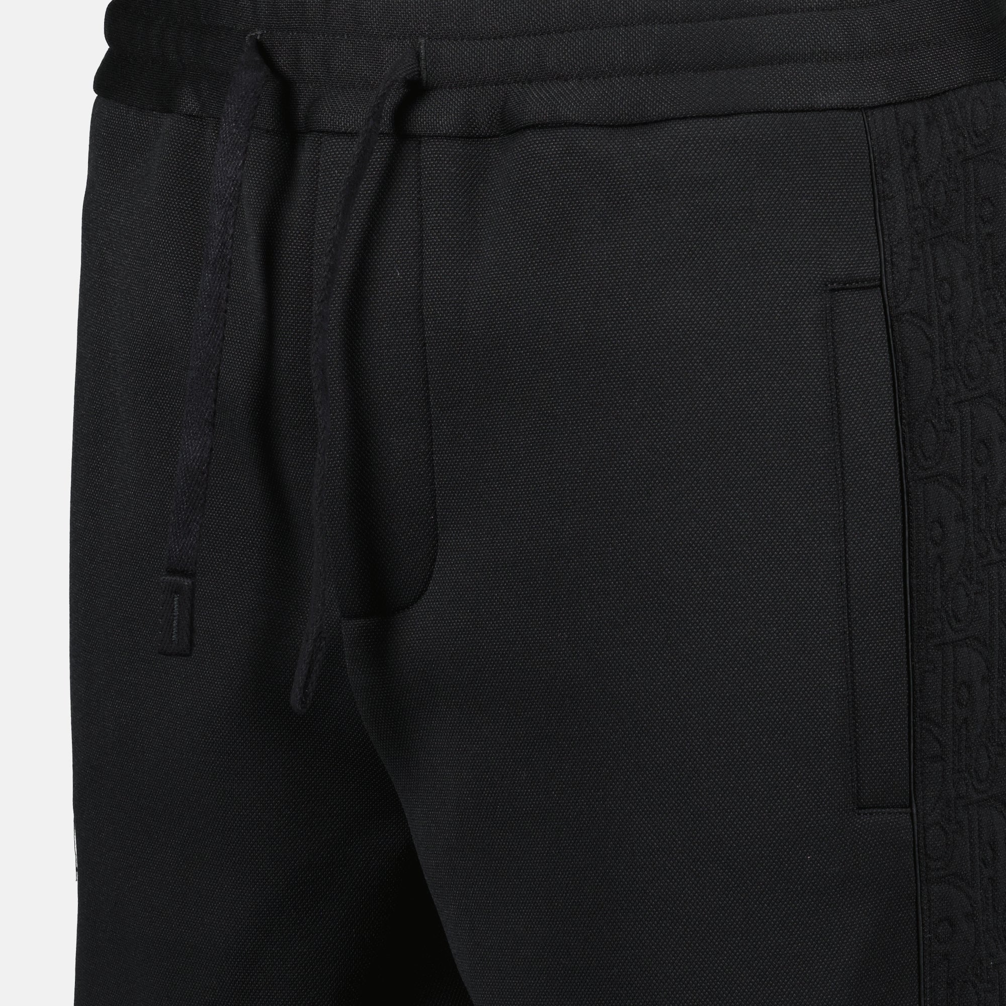 Oblique jogger pants, drawstring waist, embroidered logo, side motif, piped pockets