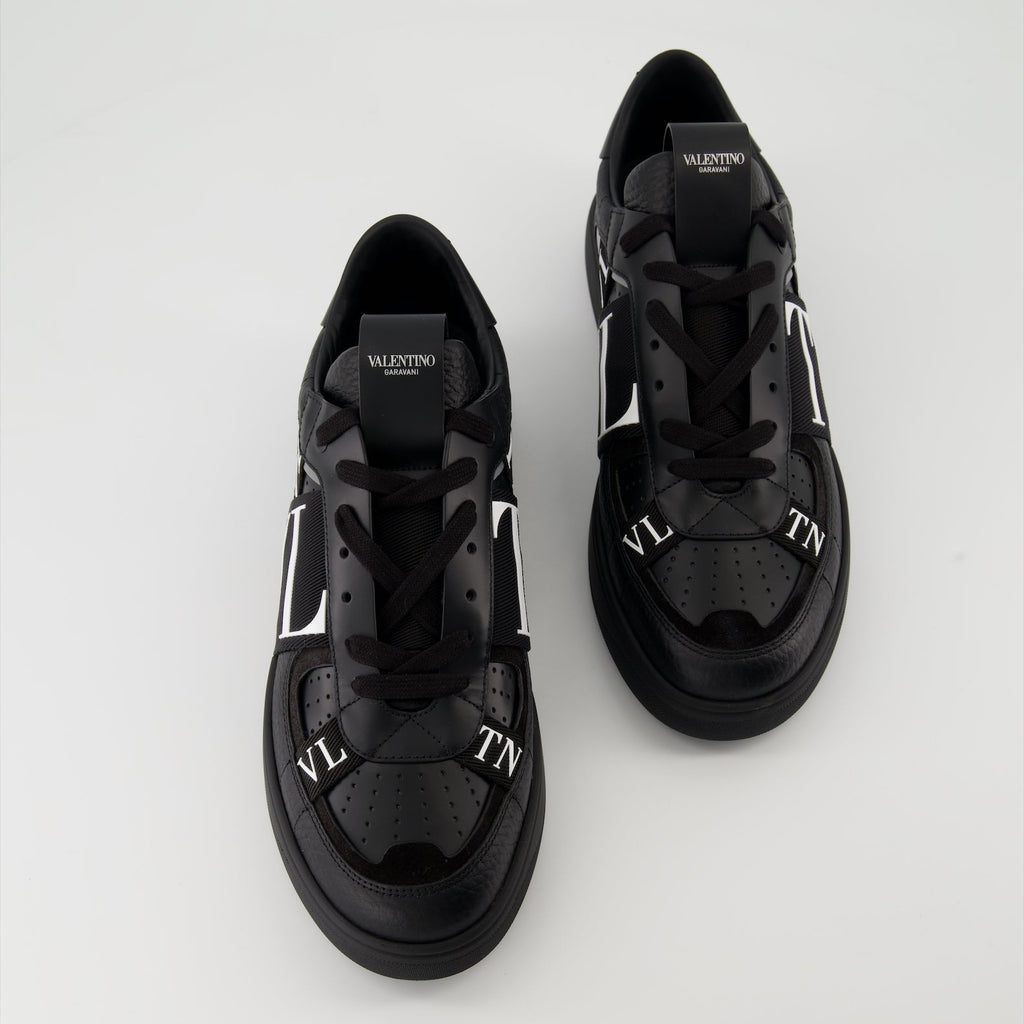 Valentino Garavani sneakers, black leather sneakers, luxury men's footwear, Autumn-Winter 2024 collection, premium grained leather