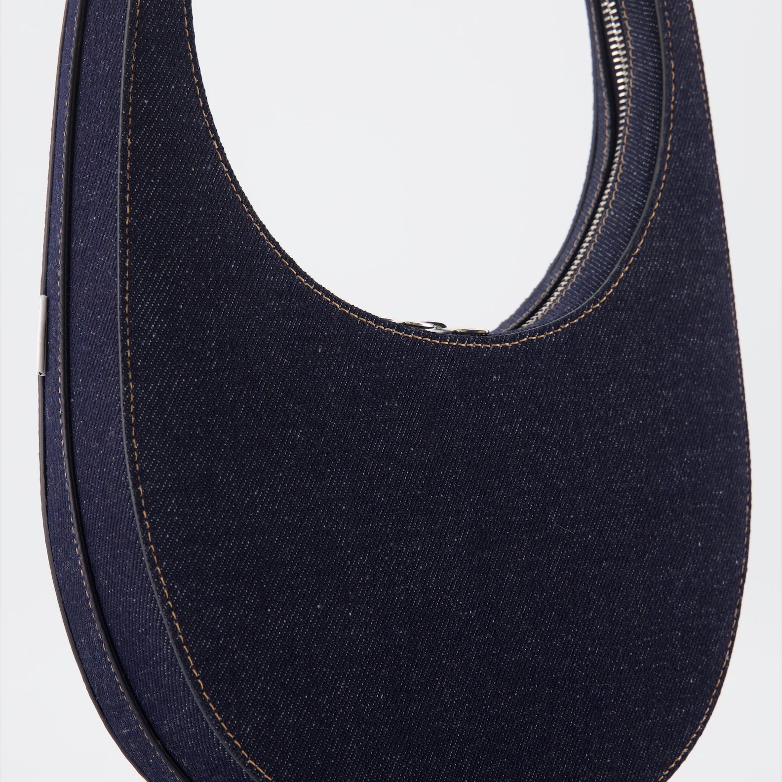 luxury denim bag, Coperni Swipe Bag, modern handbag, designer denim accessory, high-end fashion bag