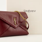 Saint Laurent pouch, red leather accessory, Cassandre design, high-quality leather bag, luxury fashion accessory
