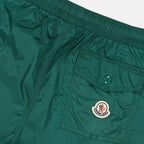 Moncler swim shorts, luxury swimwear, green swim shorts, premium beachwear, high-end swim attire