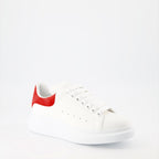 Alexander McQueen sneakers, luxury suede sneakers, red oversize sneakers, designer footwear, high-end fashion shoes
