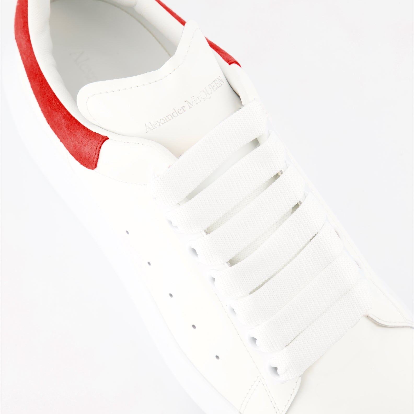 Alexander McQueen sneakers, luxury suede sneakers, red oversize sneakers, designer footwear, high-end fashion shoes