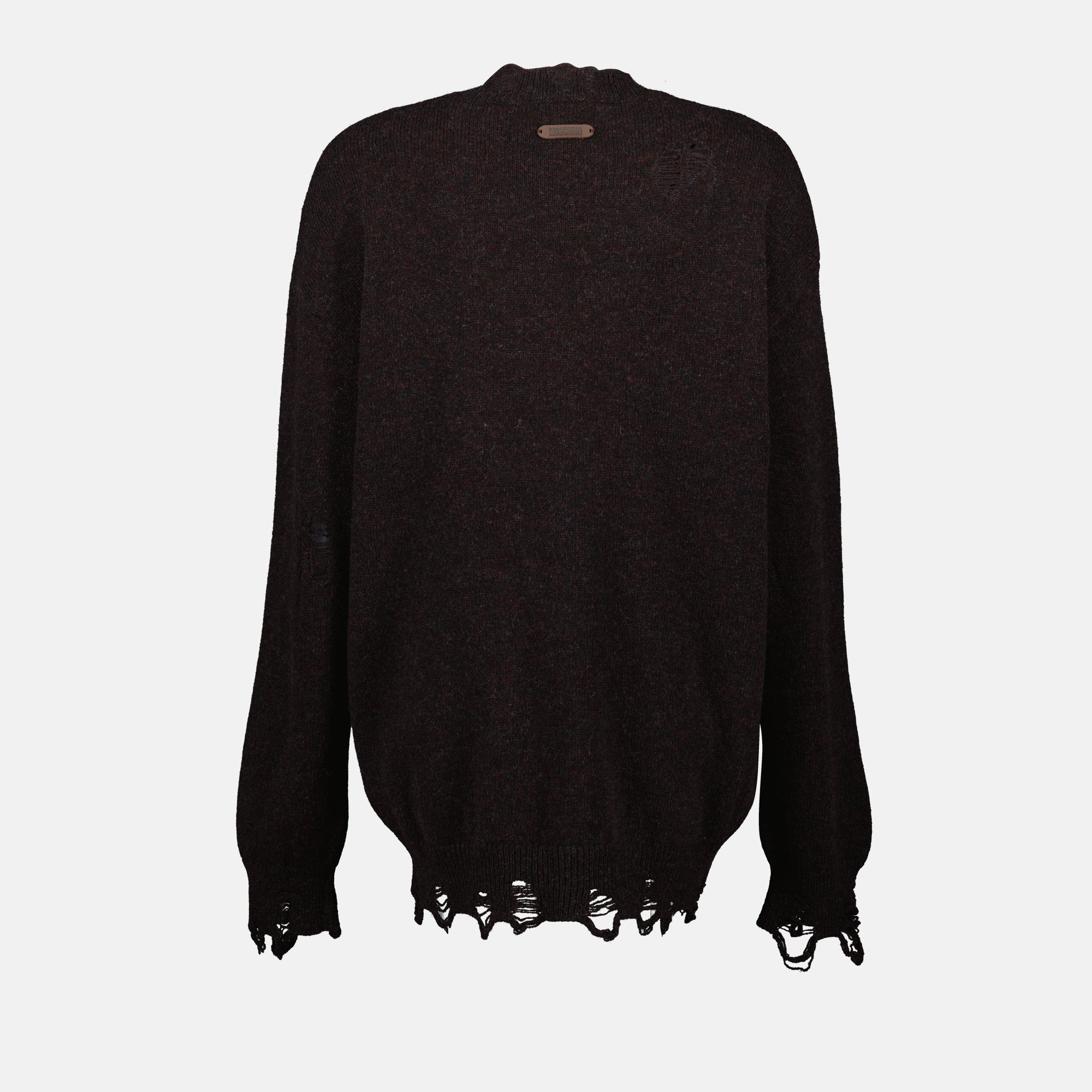 brown wool sweater, Moschino fashion, Fall-Winter 2025 collection, distressed effect clothing, luxury knitwear