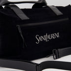elegant travel bag, black logo bag, luxury travel accessory, Saint Laurent bag, high-end travel gear