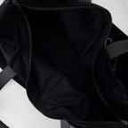 elegant travel bag, black logo bag, luxury travel accessory, Saint Laurent bag, high-end travel gear