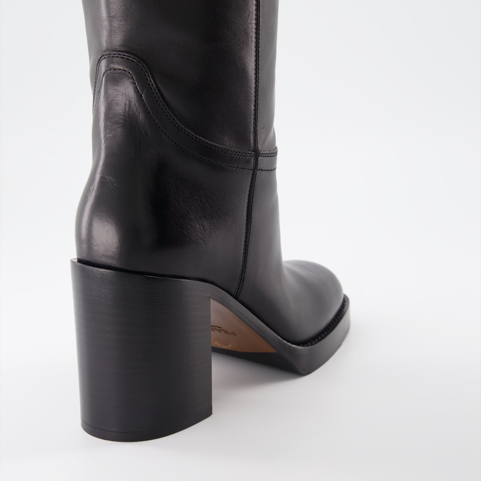 Prada leather boots, women's designer boots, black leather footwear, luxury women's boots, high-end fashion shoes