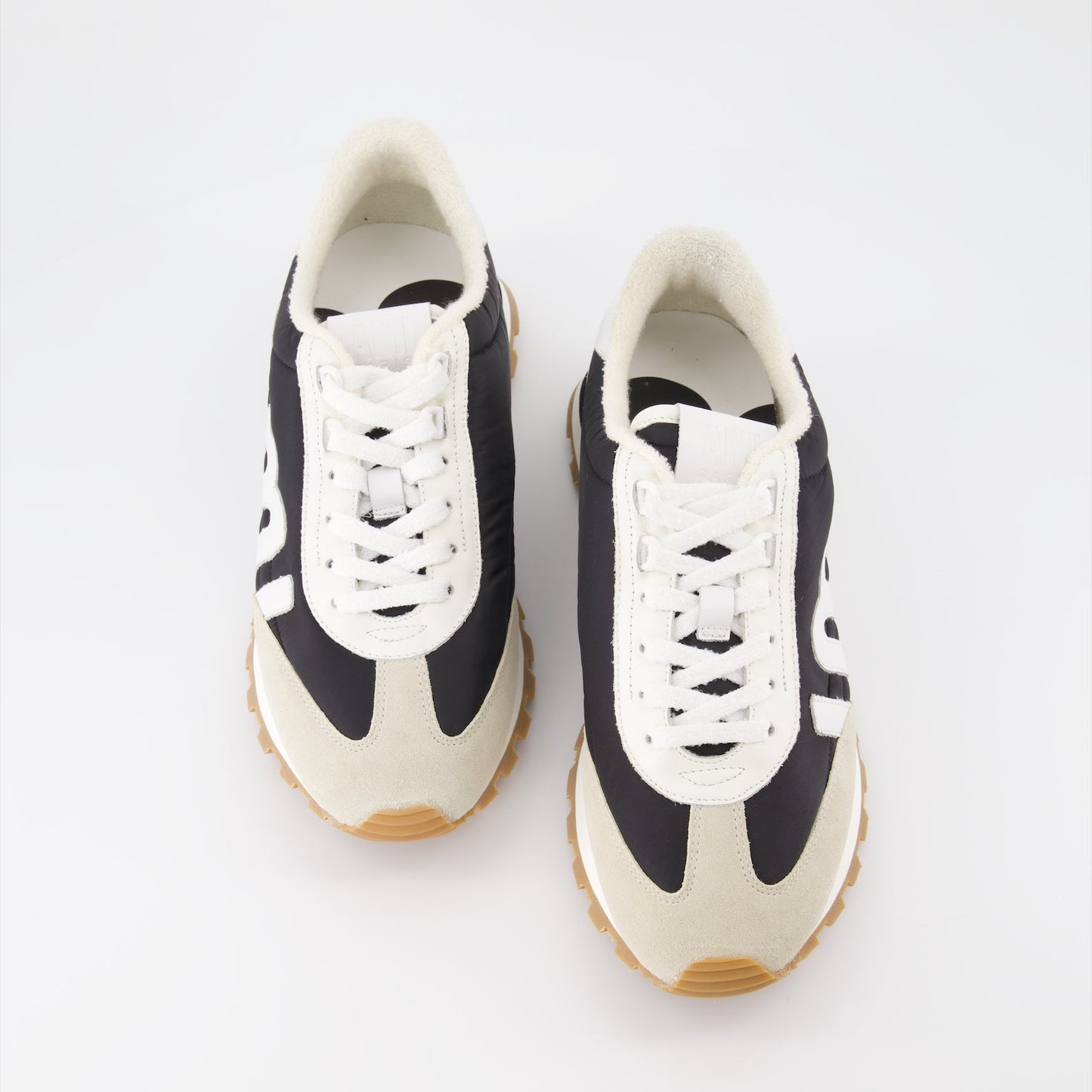 AMI Paris sneakers, unisex luxury sneakers, nylon sneakers, high-end footwear, contemporary fashion