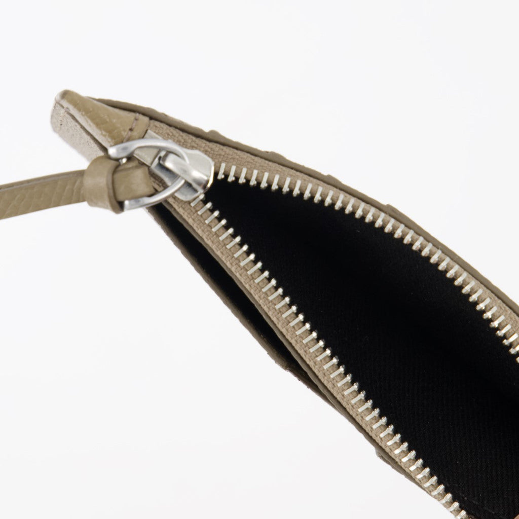 grained leather card holder, zipped card pouch, elegant card accessory, metal heart detail, sophisticated wallet