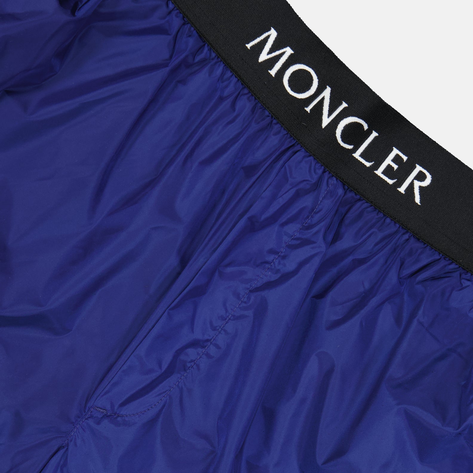 Moncler swim shorts, luxury swimwear, men's swim shorts, designer beachwear, high-end swim shorts