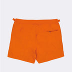 luxury swim shorts, designer swimwear, Orlebar Brown, high-end swim shorts, orange swim shorts