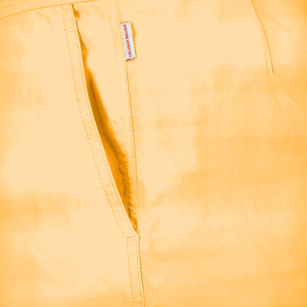 Orlebar Brown swim shorts, luxury men's swimwear, tailored swim shorts, orange swim shorts, high-end beachwear