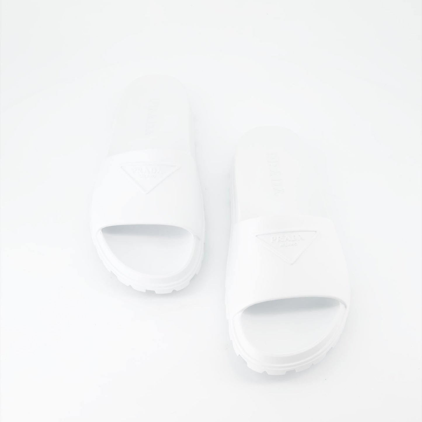 Prada men's slides, luxury men's footwear, designer slides, Prada logo slides, summer footwear