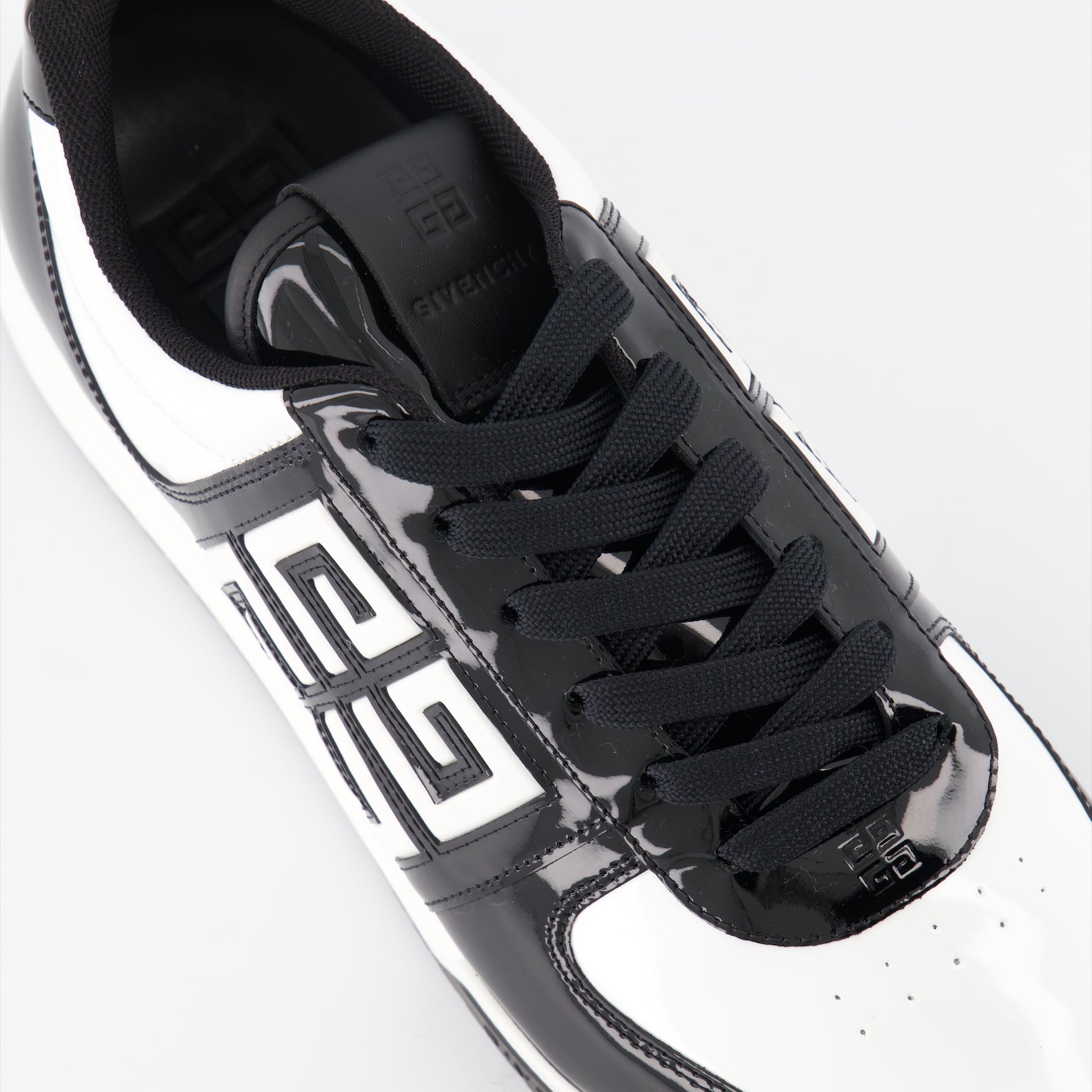 Givenchy sneakers, luxury men's footwear, black and white sneakers, high-end shoes, designer sneakers