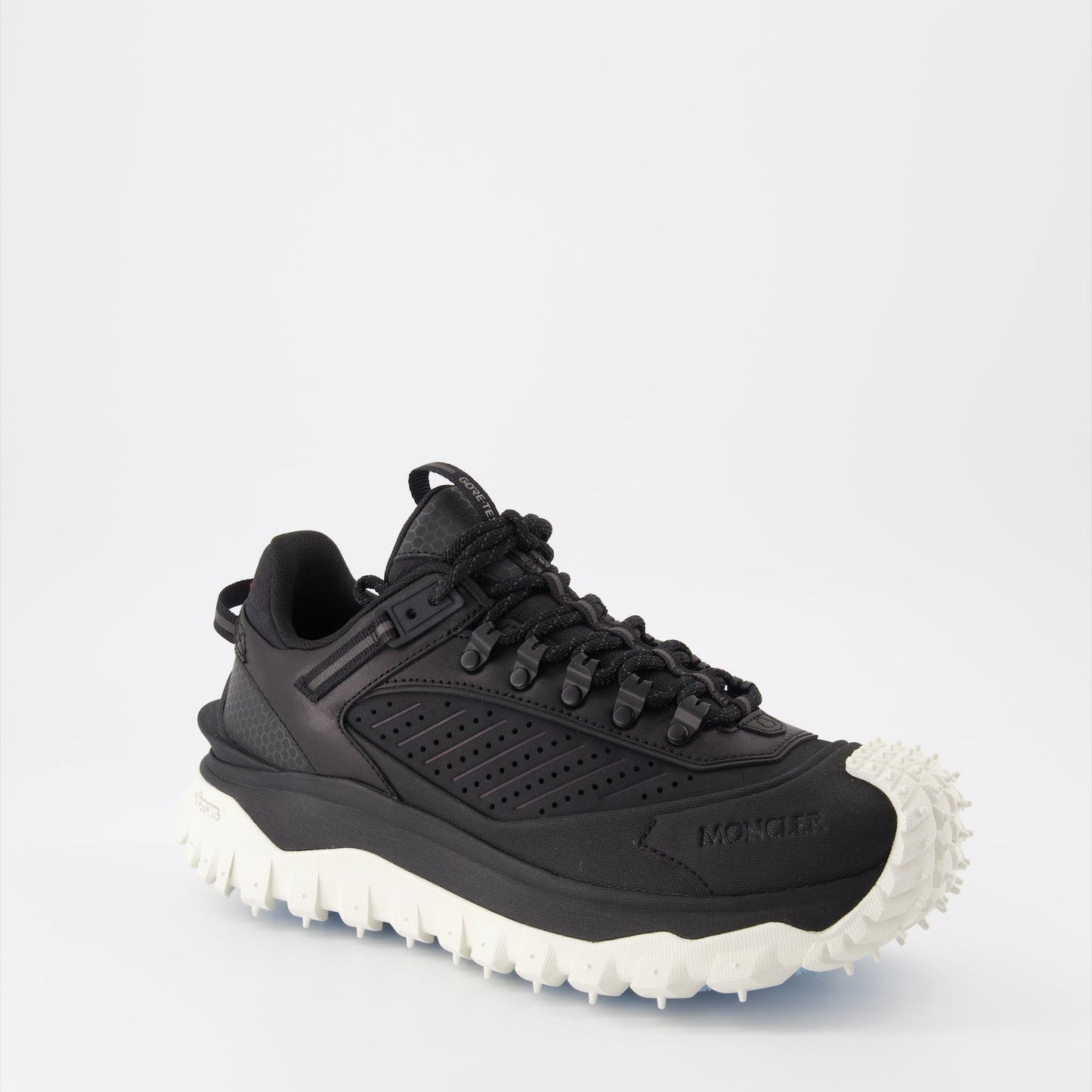 Moncler sneakers, luxury men's footwear, black Trailgrip, high-end sneakers, men's luxury fashion