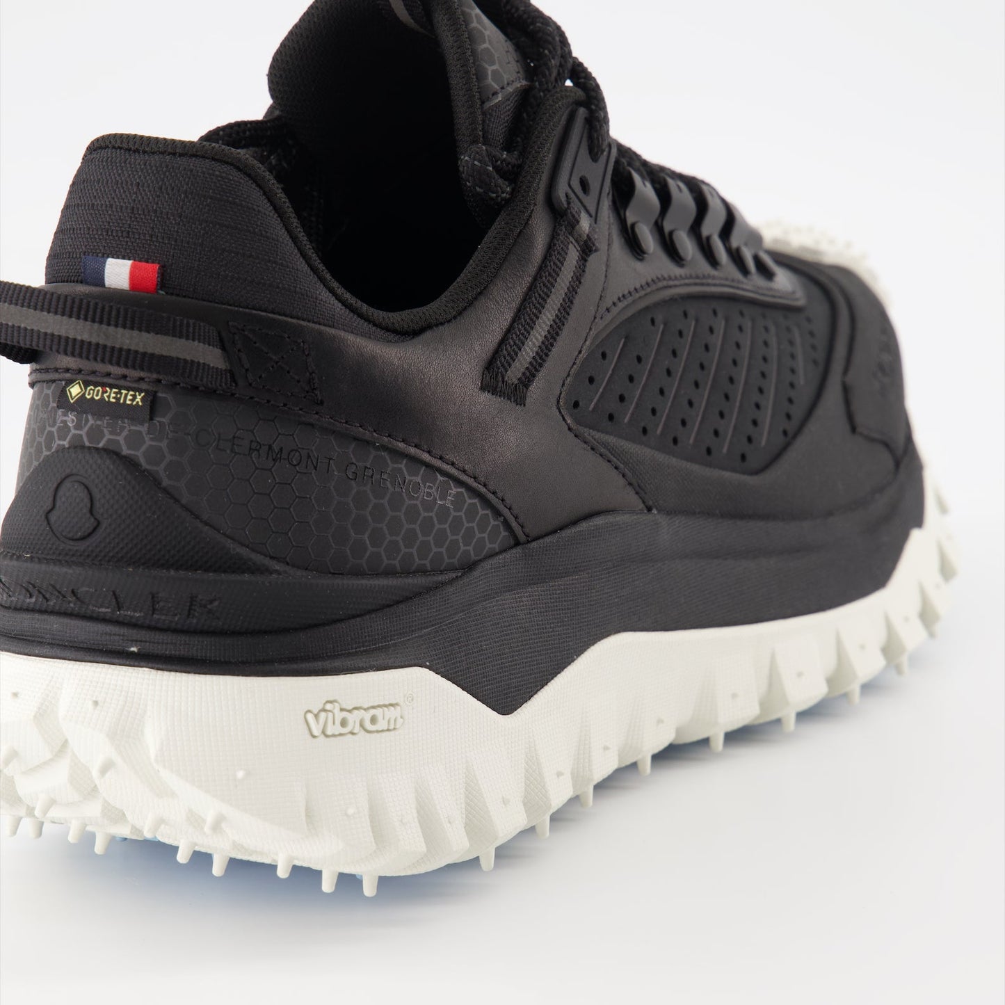 Moncler sneakers, luxury men's footwear, black Trailgrip, high-end sneakers, men's luxury fashion