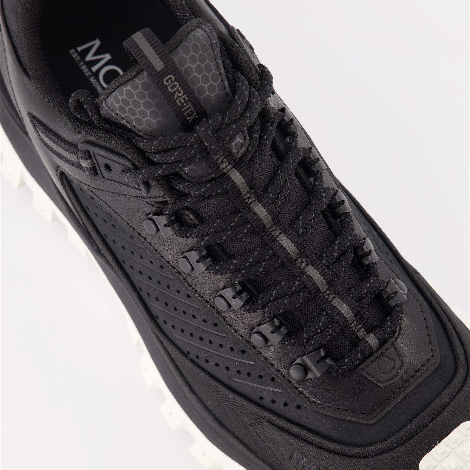 Moncler sneakers, luxury men's footwear, black Trailgrip, high-end sneakers, men's luxury fashion